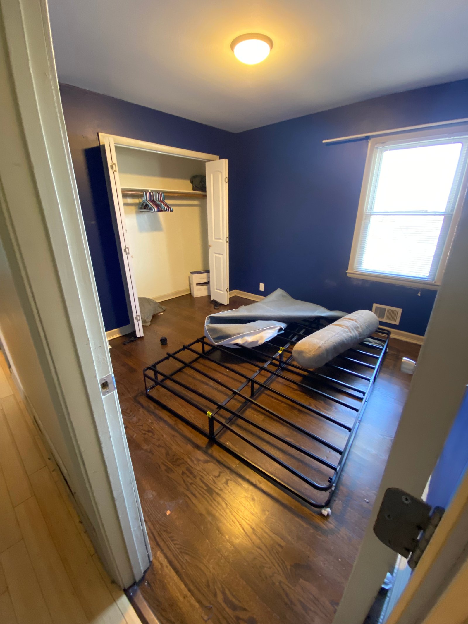 Metal bed frame in a bedroom